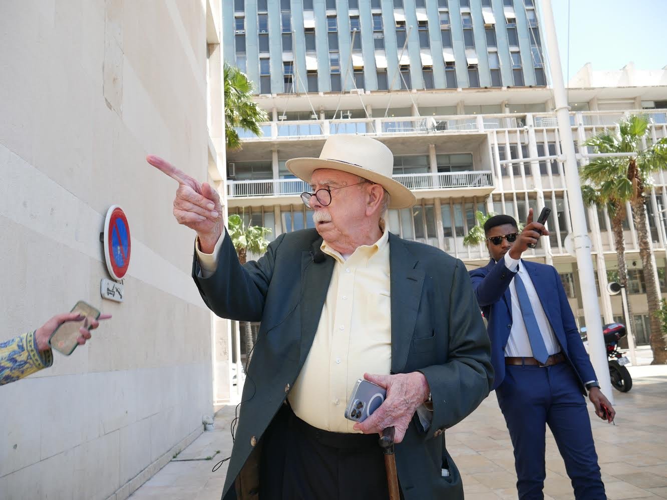 Street scene, urban setting, figures pointing