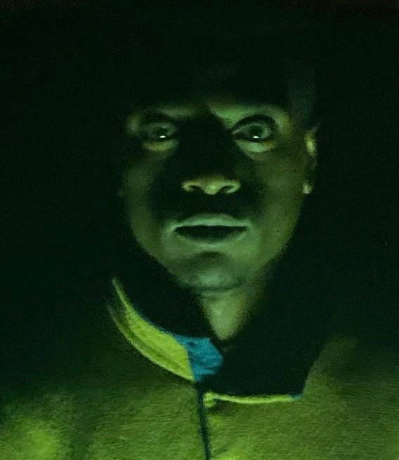 Dramatic green-lit portrait